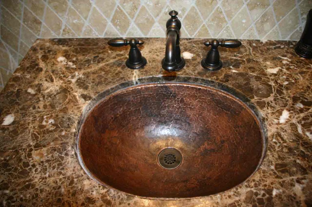 clean copper bathroom sinks