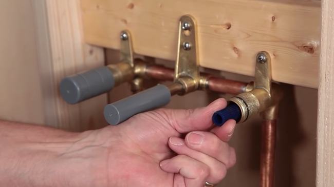Connect the water source lines and install the shutoff valves